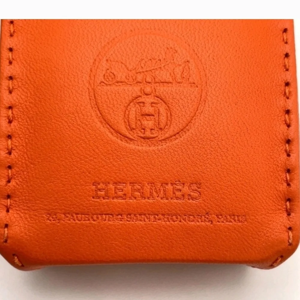 HERMÈS ORANGE LEATHER MINI POUCH BAG CHARM KEY HOLDER + BOX